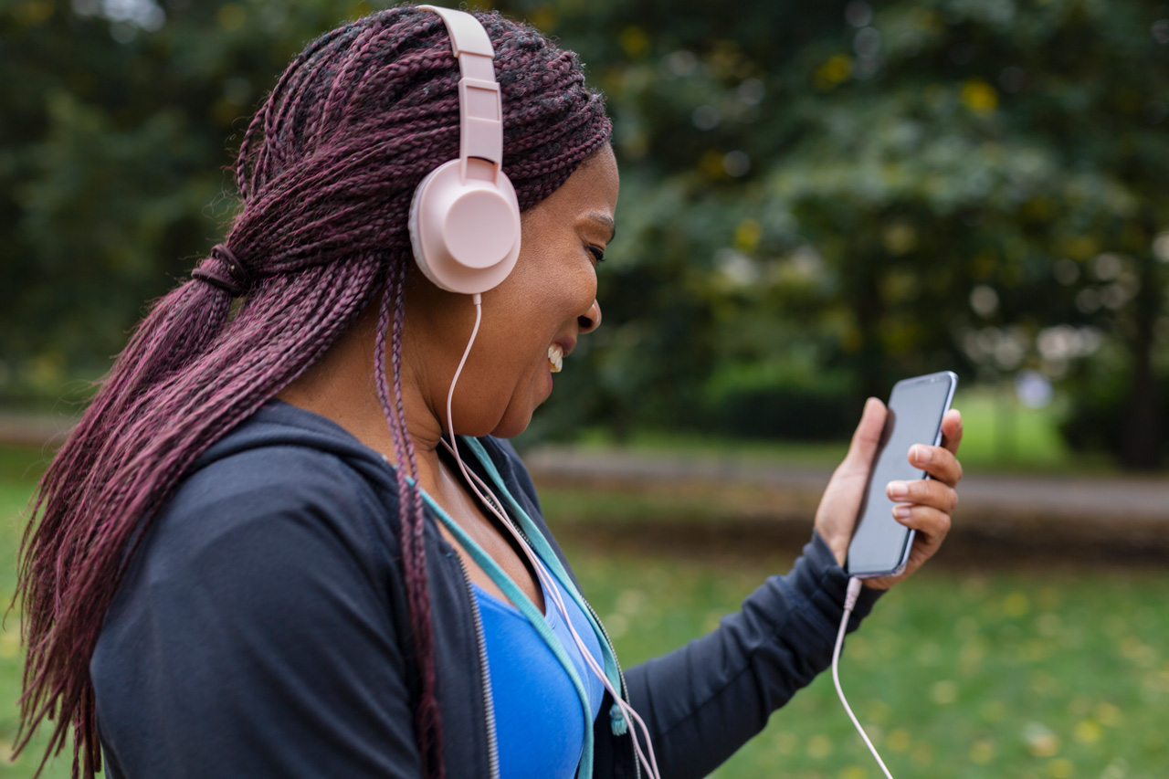 Woman enjoying music on headphones